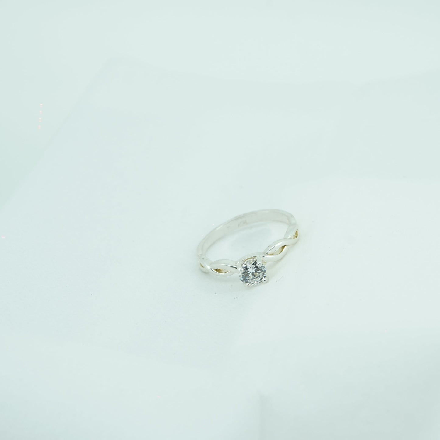 Round Cut Side Stone Ring